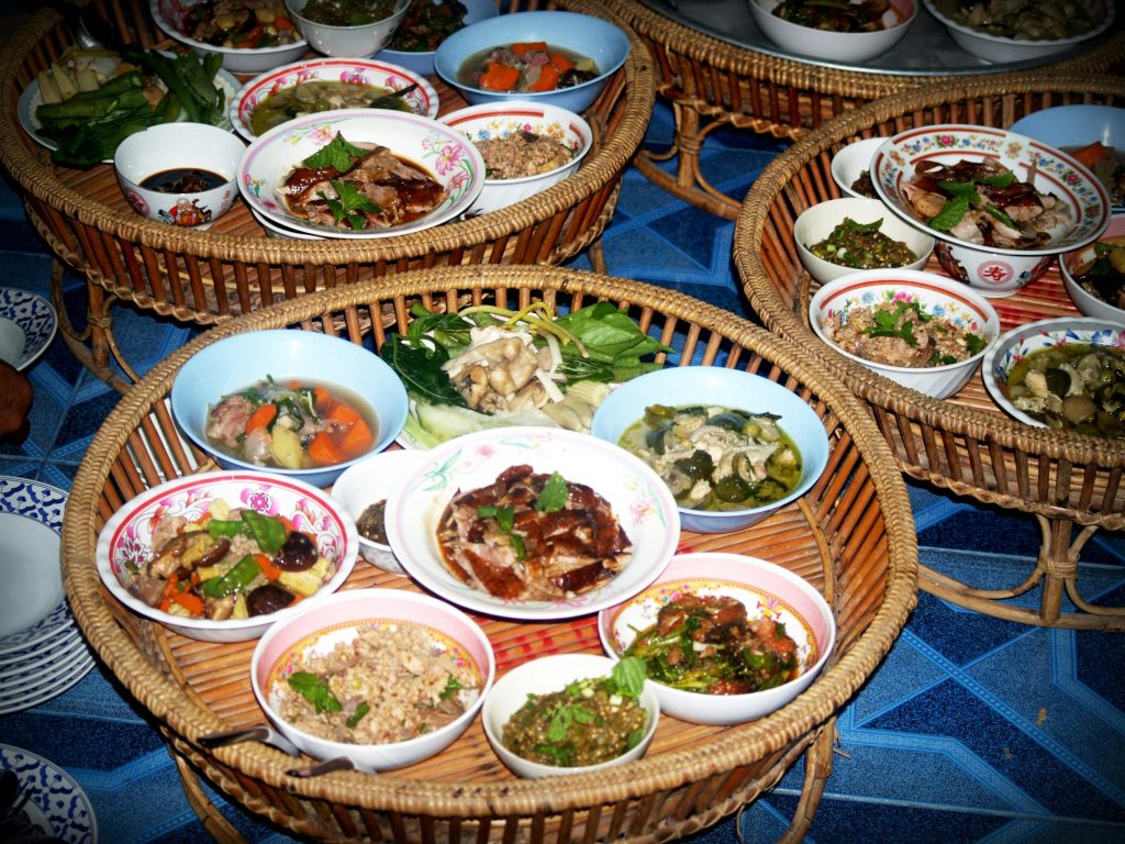 pexels photo 216571 216571 Colorful Asian dishes served on traditional bamboo trays, showcasing a variety of delicious meals.